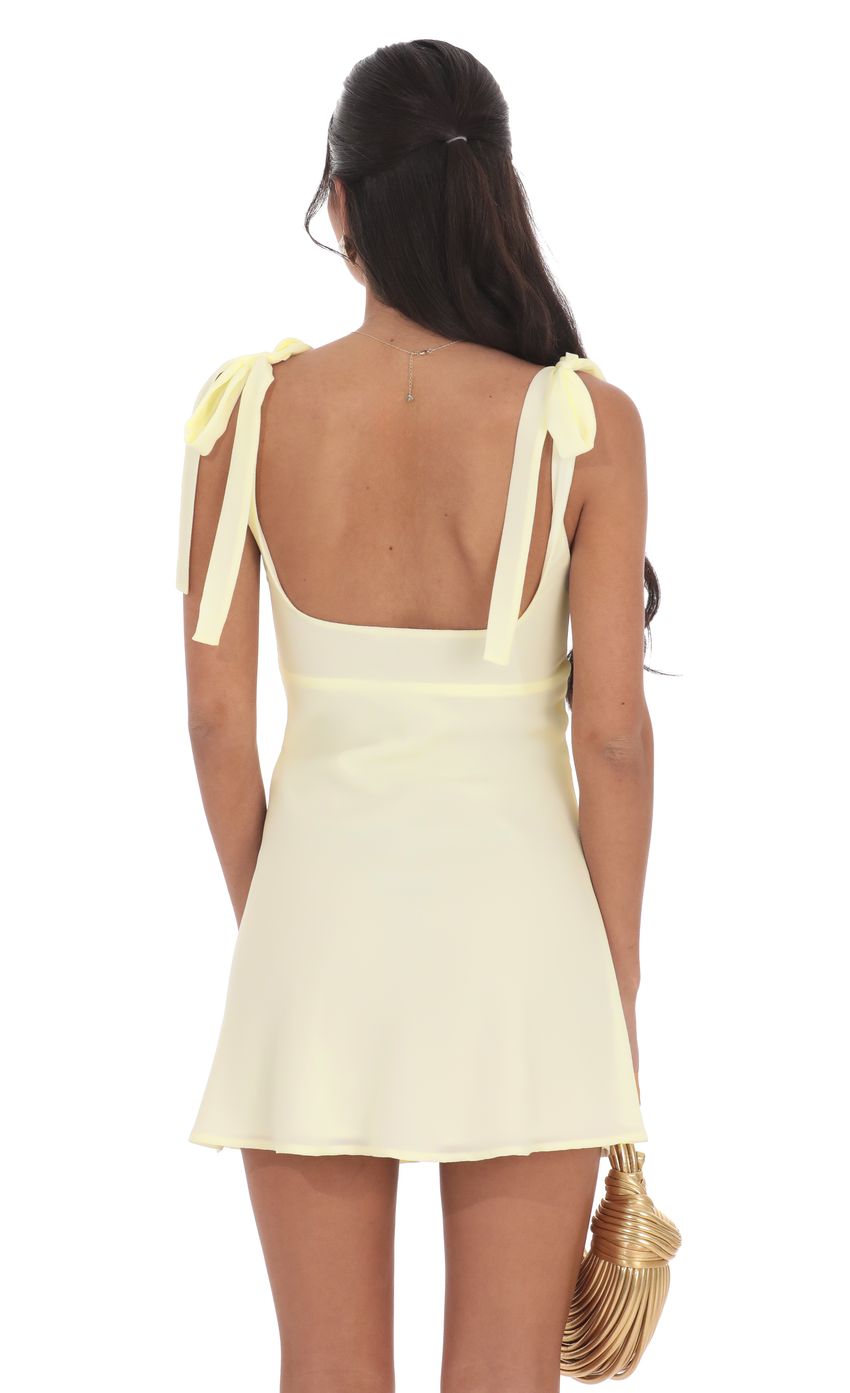 Picture Starfish Cutout Satin Dress in Pastel Yellow. Source: https://media-img.lucyinthesky.com/data/product-media/850xAUTO/6e899c4f-e429-4f01-962d-f1916af4f78f.jpg