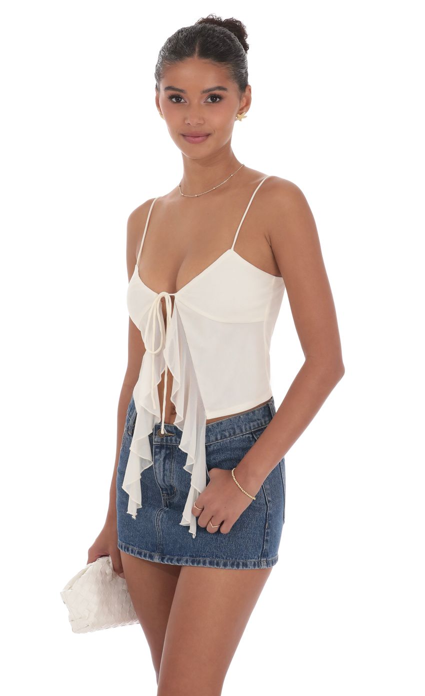 Picture Mesh Front Tassel Top in Ivory. Source: https://media-img.lucyinthesky.com/data/product-media/850xAUTO/76aa06bb-7c15-461b-b0ce-fb3c754ea400.jpg