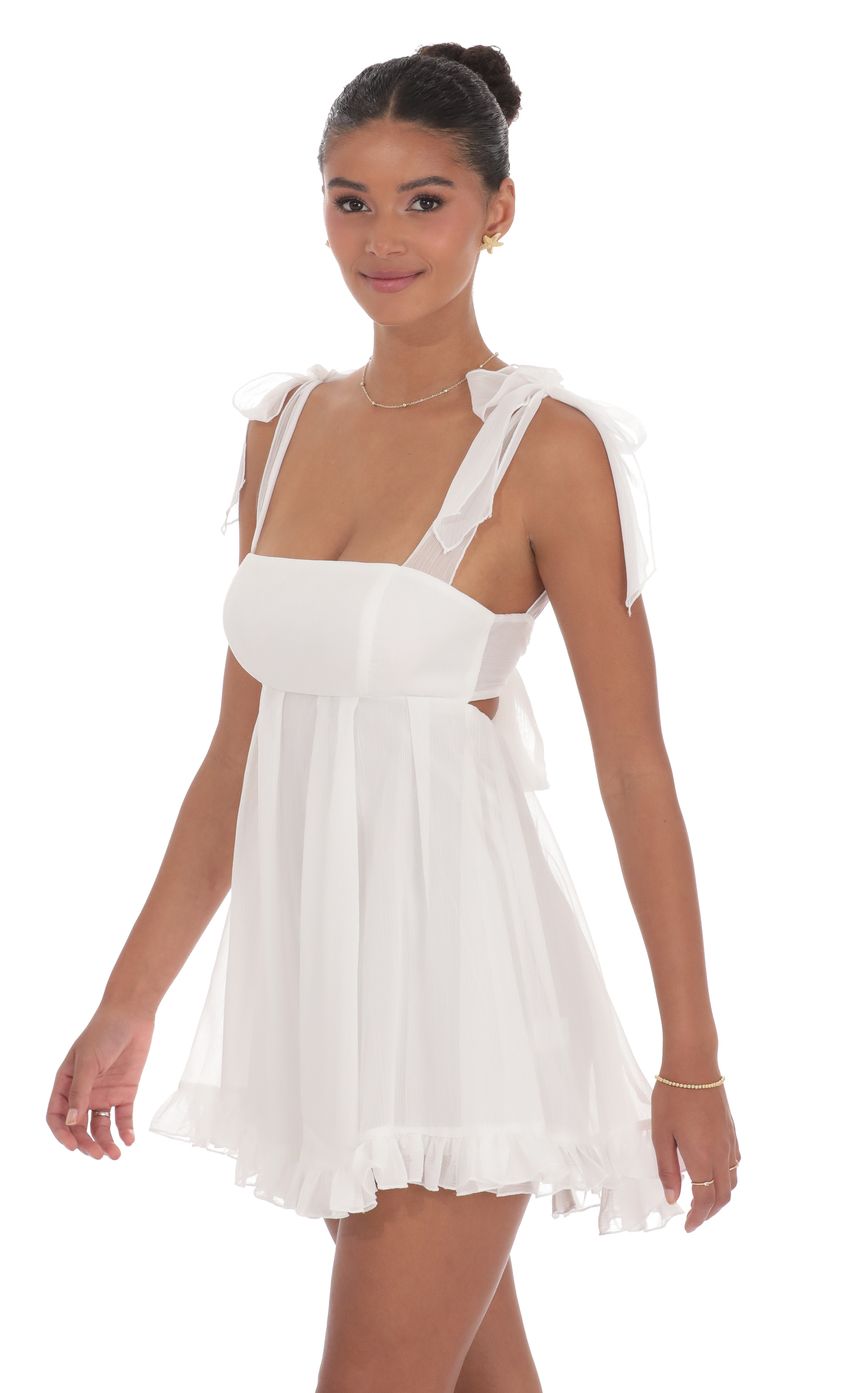 Picture Shimmer Ruffle Babydoll Dress in White. Source: https://media-img.lucyinthesky.com/data/product-media/850xAUTO/779912f0-3455-4c36-a7b8-5ec896676bed.jpg