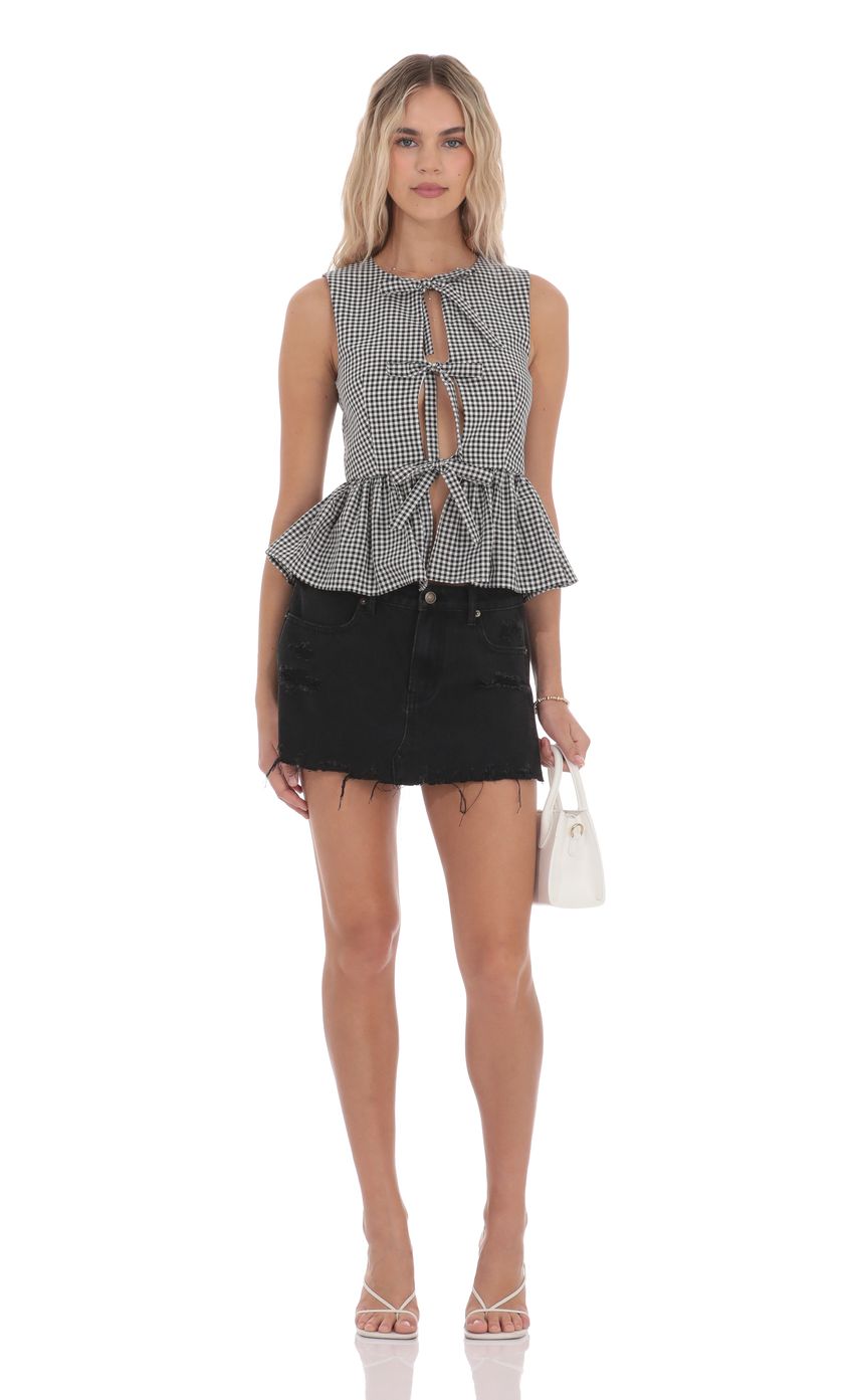 Picture Gingham Peplum Vest in Black and White. Source: https://media-img.lucyinthesky.com/data/product-media/850xAUTO/7bd9284b-6d5b-4a42-b964-fe3a24153fcc.jpg