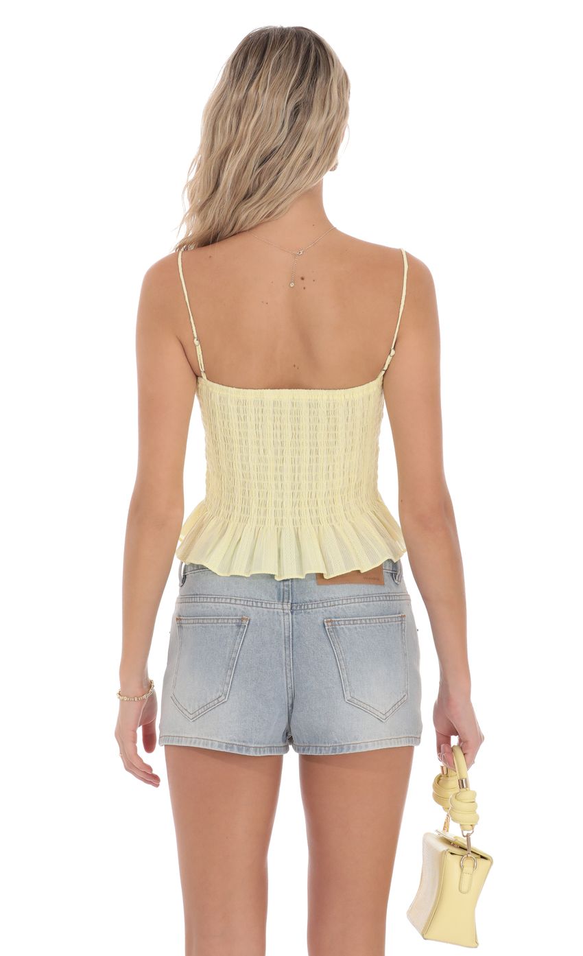 Picture Smocked Button Top in Yellow. Source: https://media-img.lucyinthesky.com/data/product-media/850xAUTO/7d2da842-a59c-44b1-ab0b-beea4a2cb412.jpg