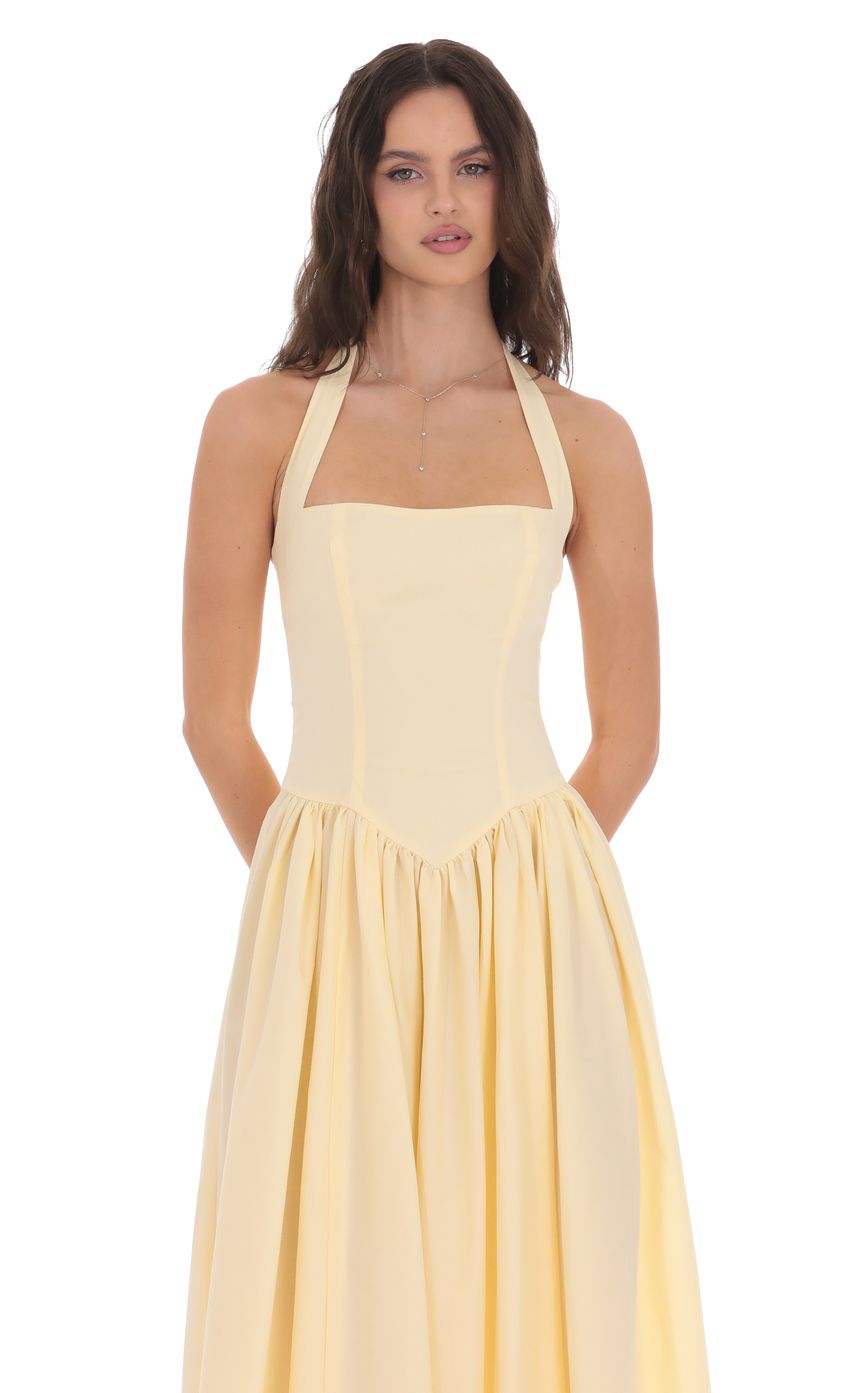 Picture Halter Midi Dress in Yellow. Source: https://media-img.lucyinthesky.com/data/product-media/850xAUTO/7e1ecf25-326a-4e32-8214-c83107014bec.jpg