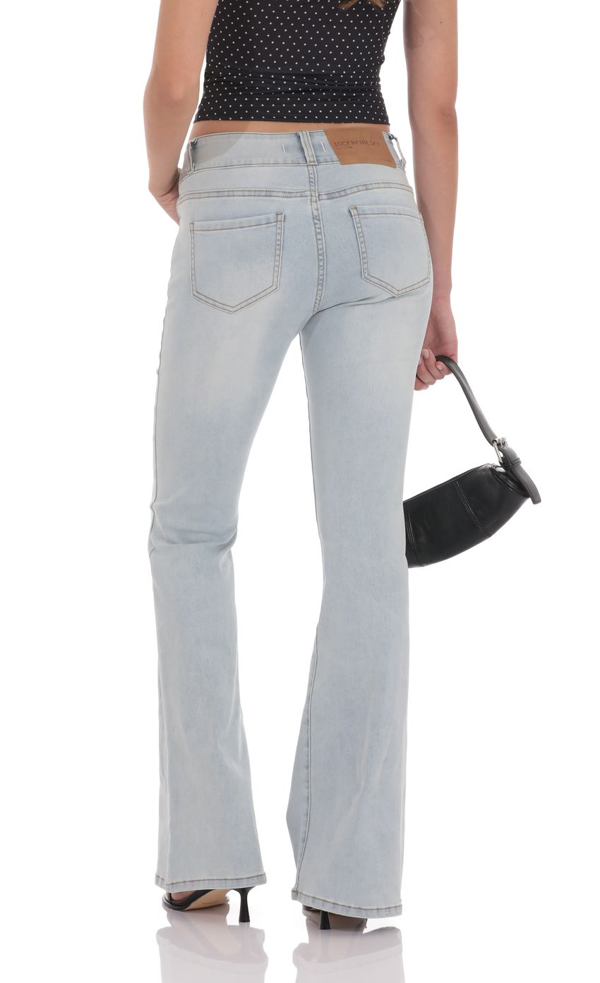 Picture Low Rise Flare Jeans in Light Denim. Source: https://media-img.lucyinthesky.com/data/product-media/850xAUTO/85a734bc-610b-4328-a9bb-b45a6a5377df.jpg