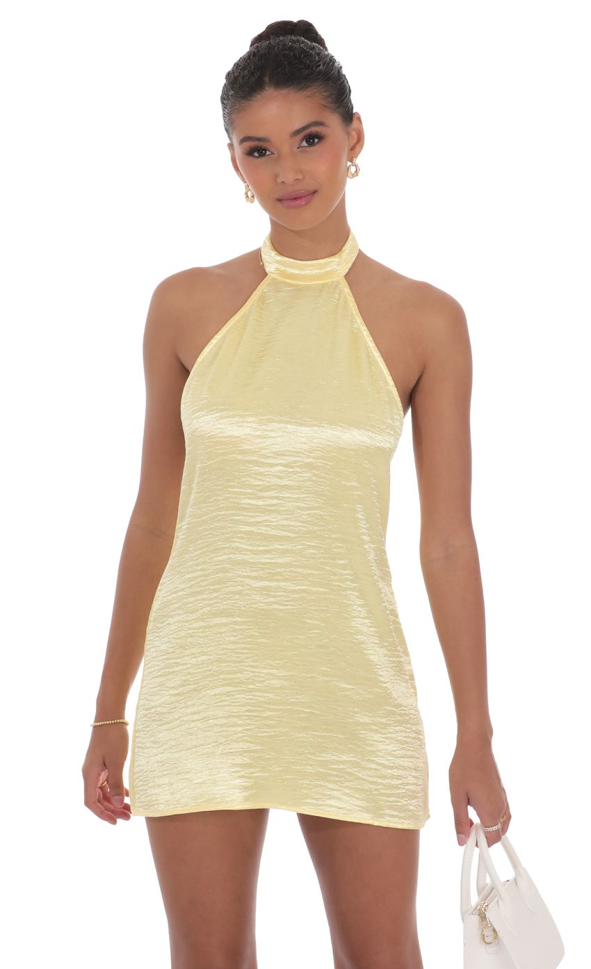 Picture Satin Halter Shift Dress in Yellow. Source: https://media-img.lucyinthesky.com/data/product-media/850xAUTO/8c6cc338-8459-4434-a196-f814718e8827.jpg