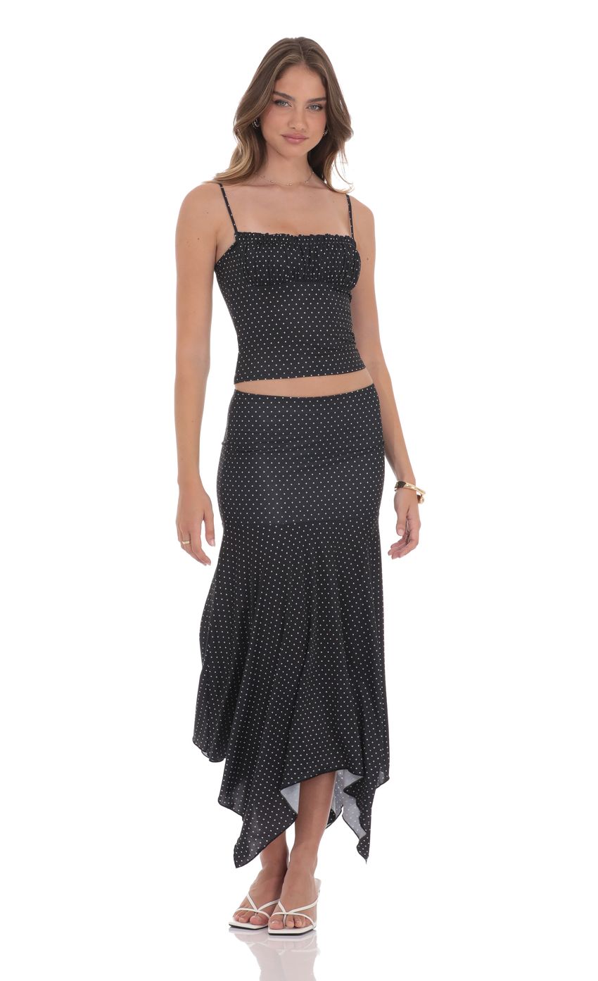 Picture Polka Dot Ruched Bust Top in Black. Source: https://media-img.lucyinthesky.com/data/product-media/850xAUTO/8df8a97b-7041-4c56-9d35-b25d74a094c4.jpg