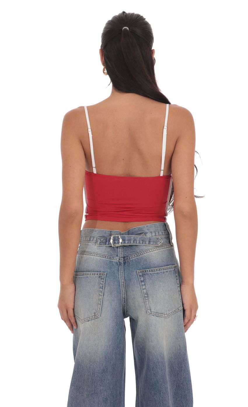 Picture Outline Crop Top in Sky Red. Source: https://media-img.lucyinthesky.com/data/product-media/850xAUTO/954059a3-7411-49d2-8442-cfc288b882d2.jpg