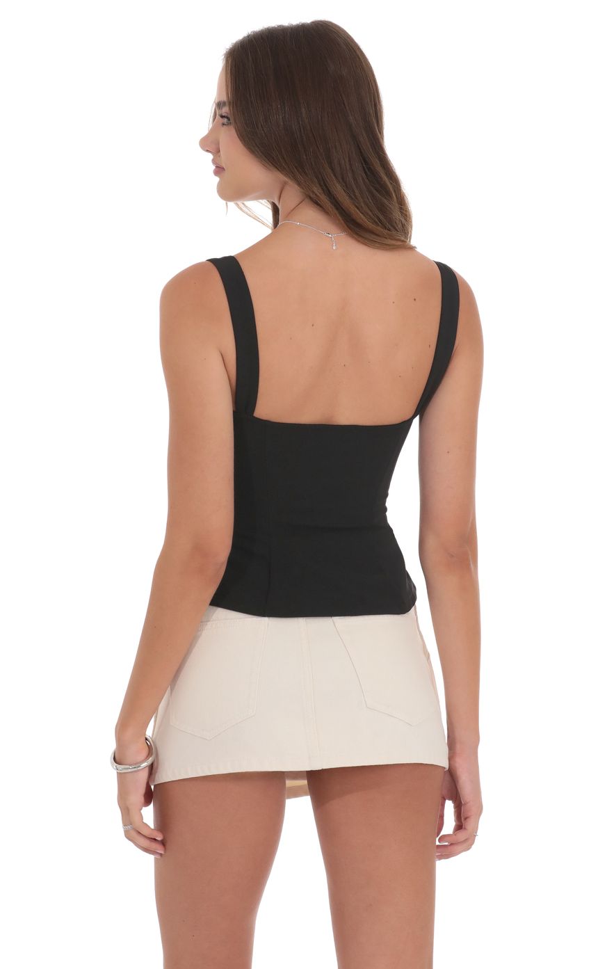 Picture Ruched Flare Top in Black. Source: https://media-img.lucyinthesky.com/data/product-media/850xAUTO/99bc7a7f-8849-42e3-92e1-4e4e63dc072a.jpg