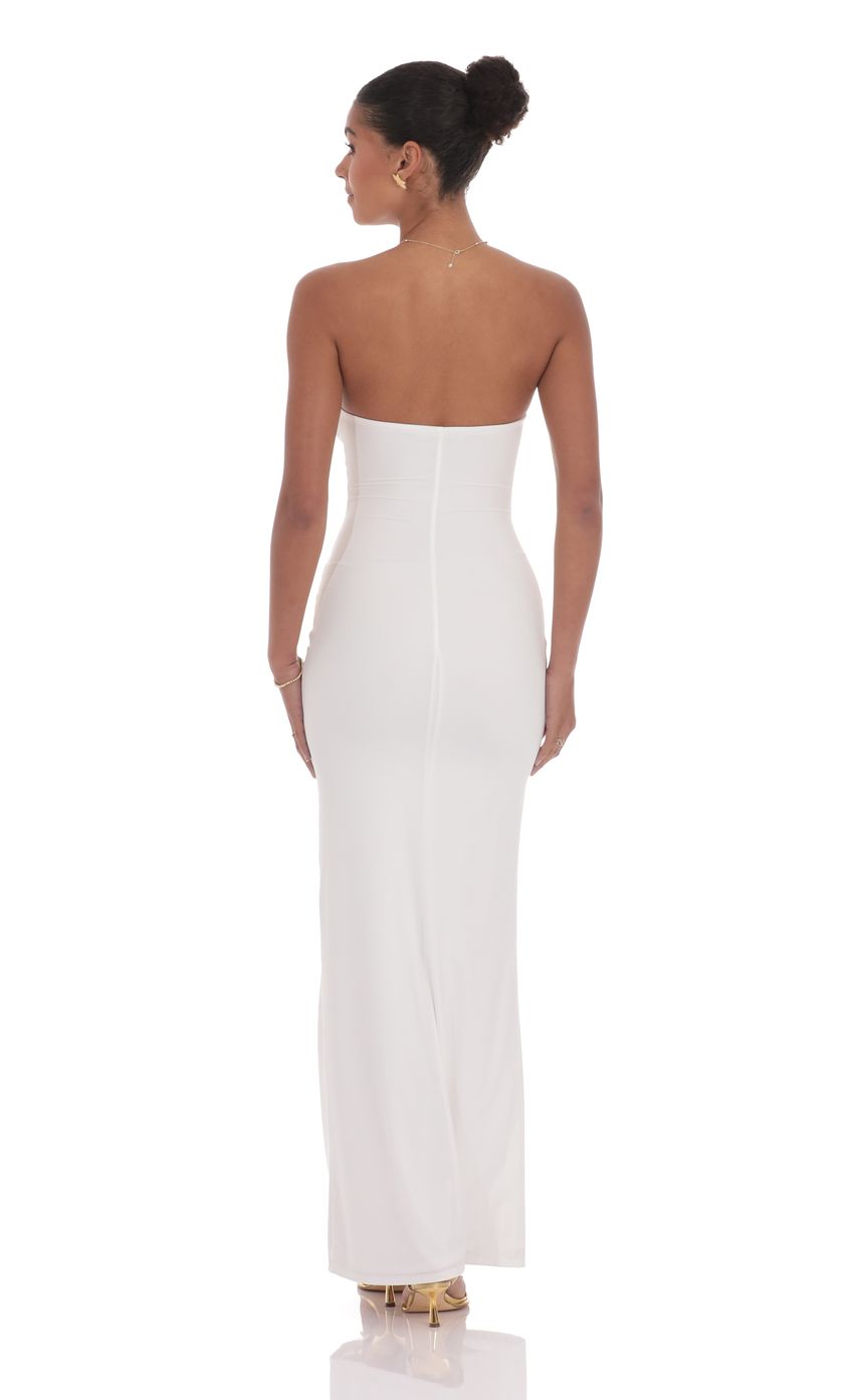 Picture Golden Rose Cutout Maxi Dress in White. Source: https://media-img.lucyinthesky.com/data/product-media/850xAUTO/a00efeec-2b2a-44c1-8f38-8fa5d39386d2.jpg