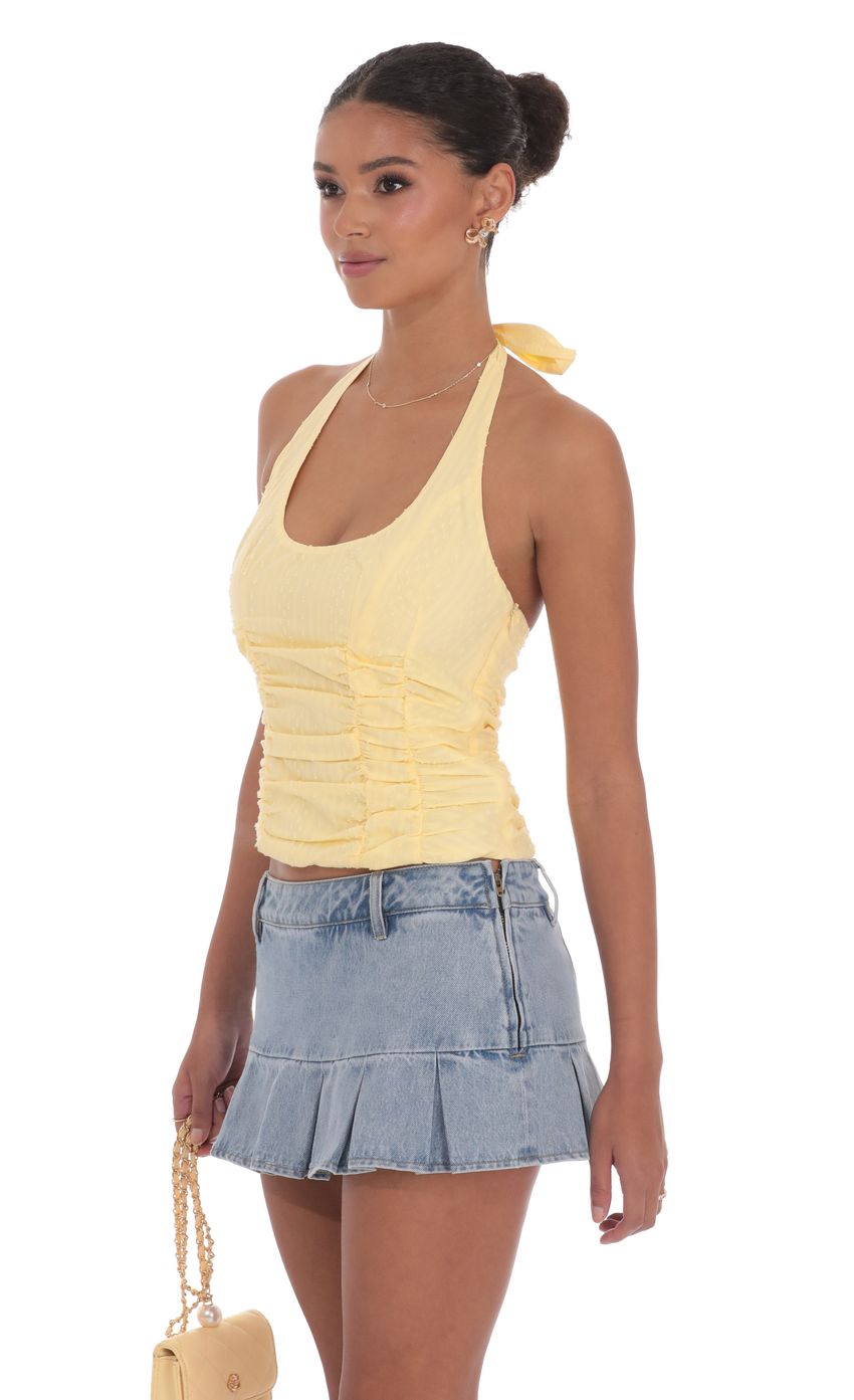 Picture Dotted Halter Top in Yellow. Source: https://media-img.lucyinthesky.com/data/product-media/850xAUTO/a13f28c3-46b7-46e9-80ac-7bb4d2b91815.jpg