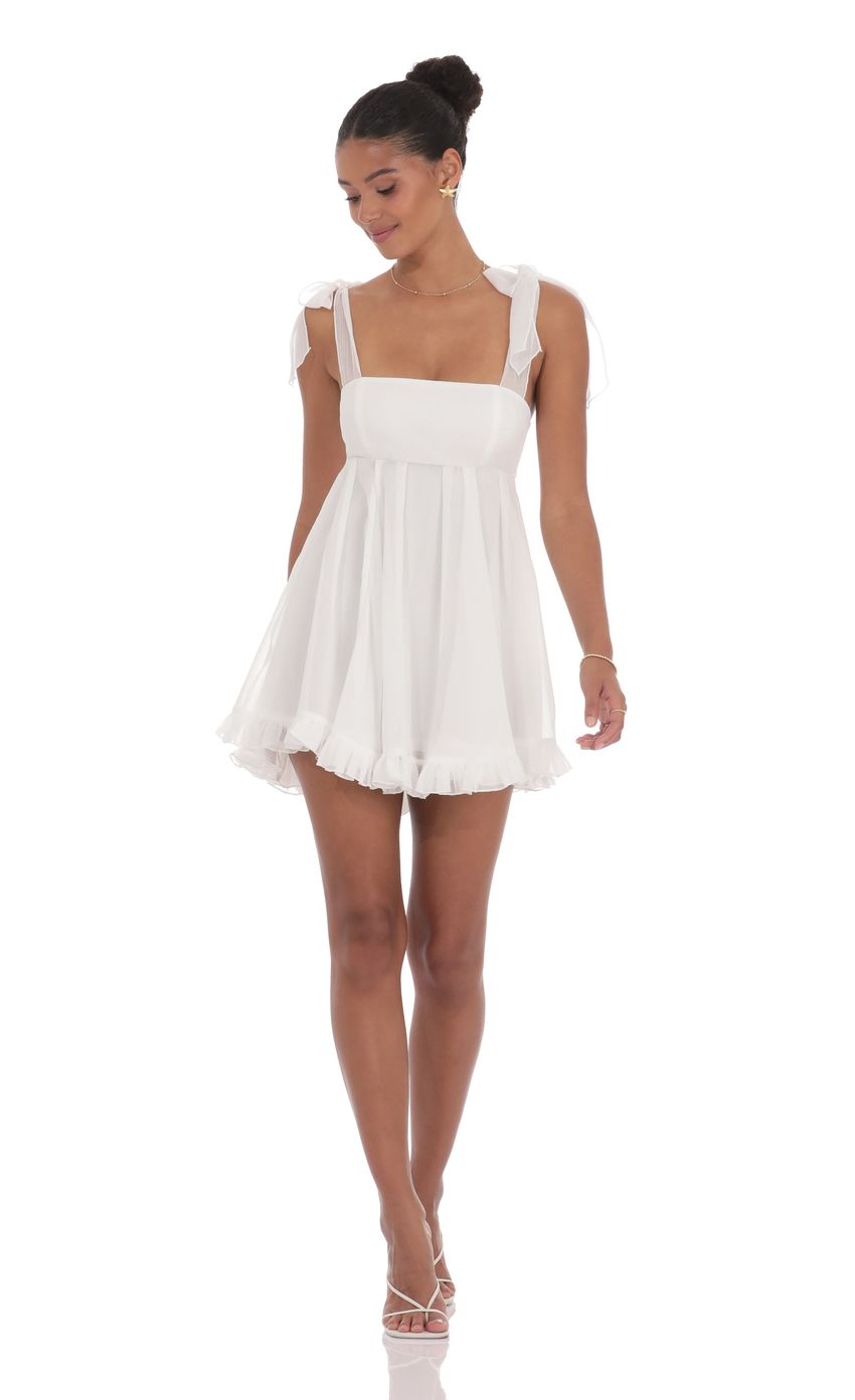 Picture Shimmer Ruffle Babydoll Dress in White. Source: https://media-img.lucyinthesky.com/data/product-media/850xAUTO/a49facca-5f51-4a8e-a85f-bceb265e5d07.jpg