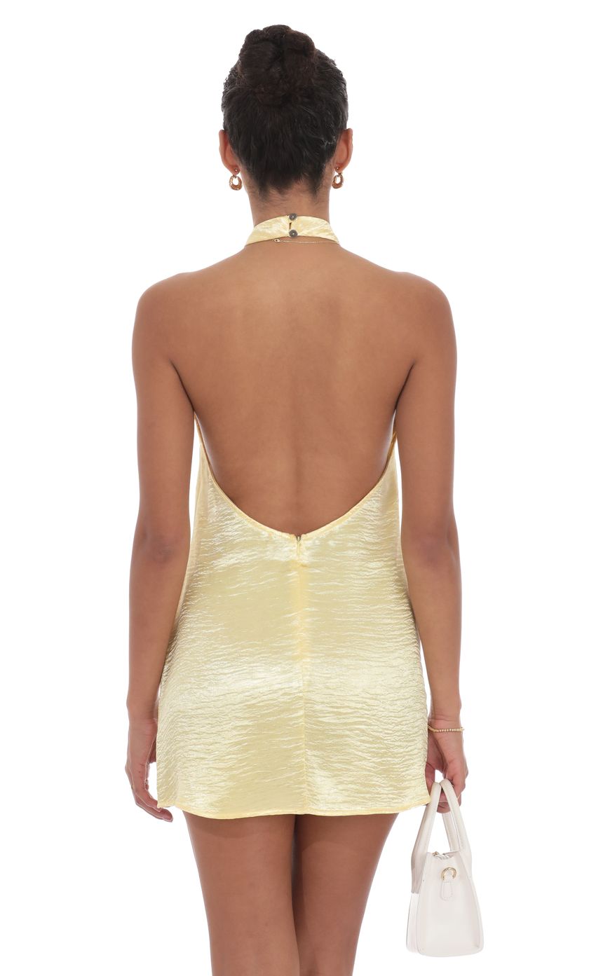Picture Satin Halter Shift Dress in Yellow. Source: https://media-img.lucyinthesky.com/data/product-media/850xAUTO/a601e0c7-4d15-4cdd-9fd5-8318915ffe8f.jpg