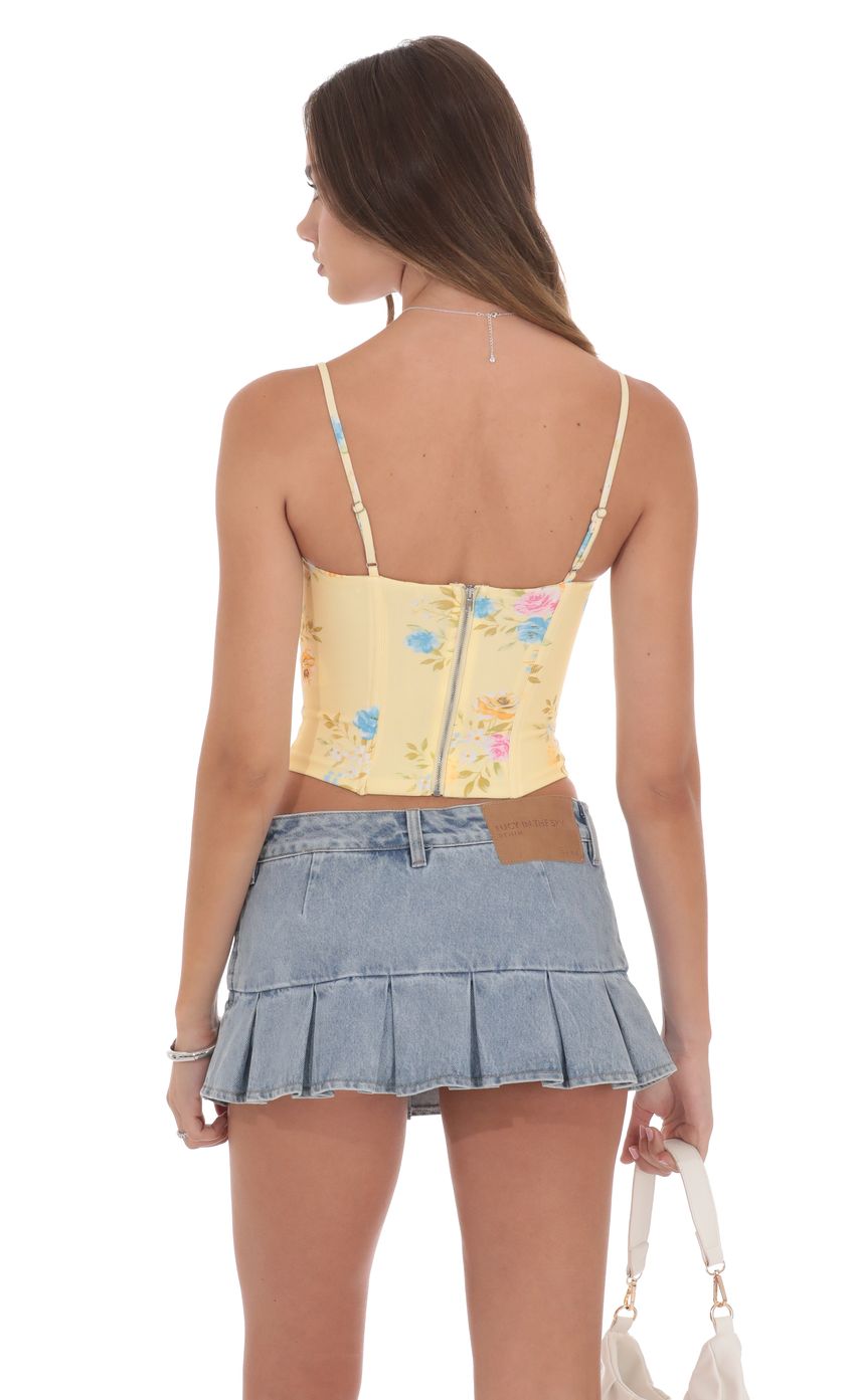 Picture Pointed Floral Corset Top in Yellow. Source: https://media-img.lucyinthesky.com/data/product-media/850xAUTO/aab4665c-8327-40cb-8151-7fc6605cffe0.jpg