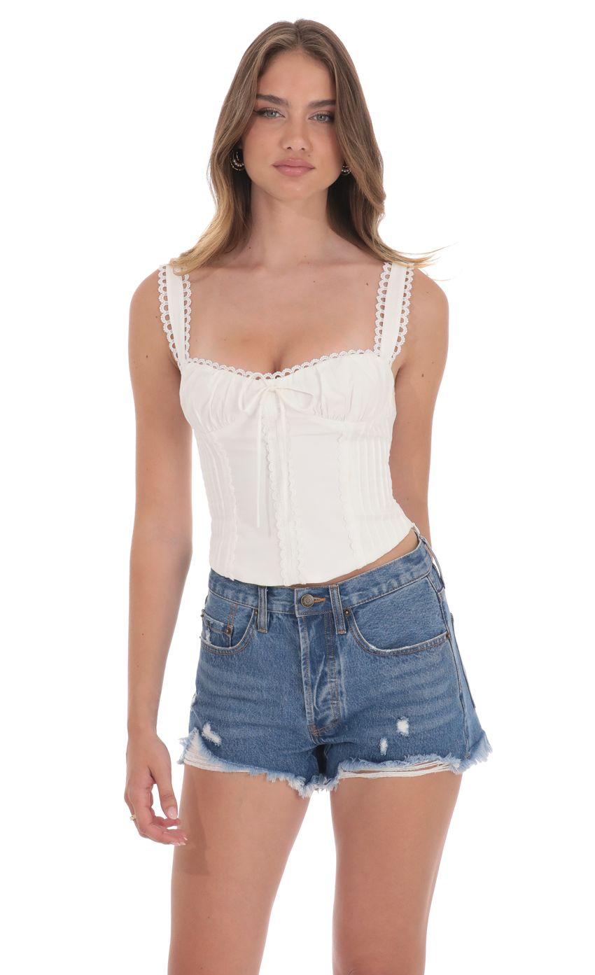 Picture Distressed High Waisted Denim Shorts in Blue. Source: https://media-img.lucyinthesky.com/data/product-media/850xAUTO/abf55eca-9d6f-4ae6-b36c-aa442fcd1d32.jpg