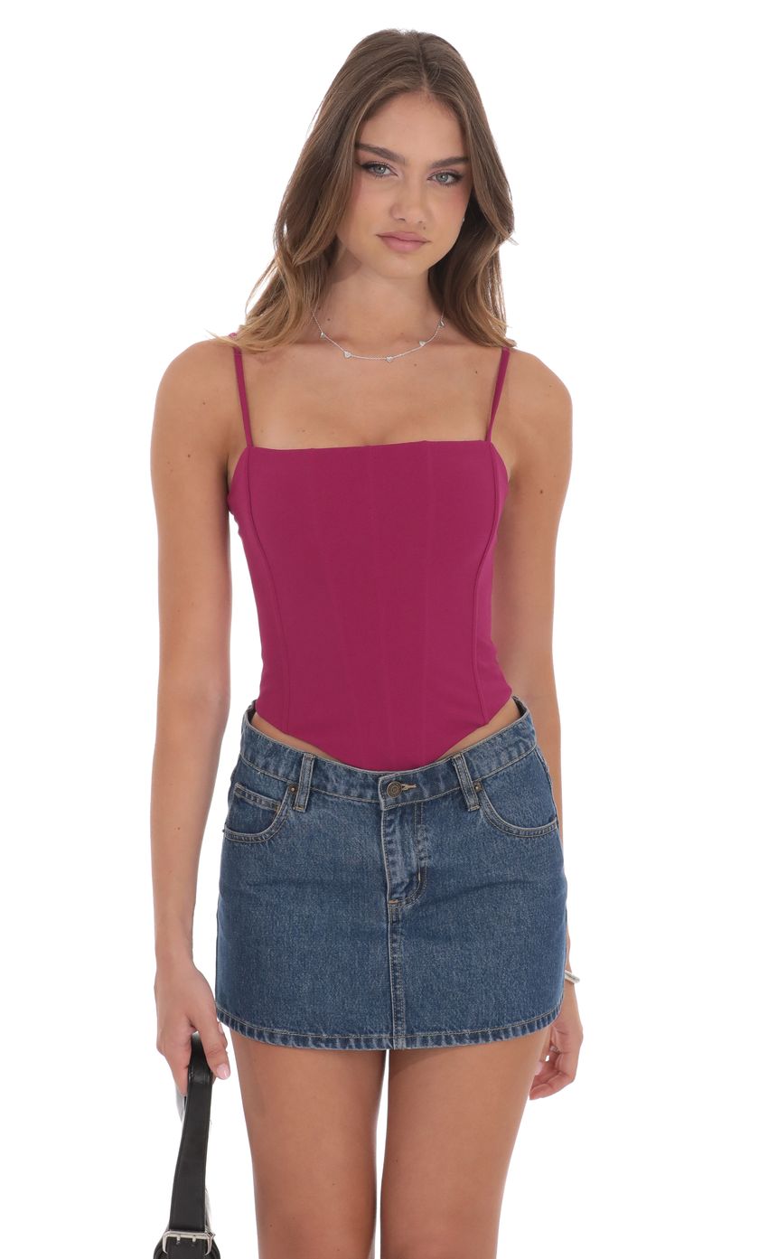 Picture Pointed Corset Top in Magenta. Source: https://media-img.lucyinthesky.com/data/product-media/850xAUTO/b1716f98-d340-4771-a8ff-852a681c30e7.jpg