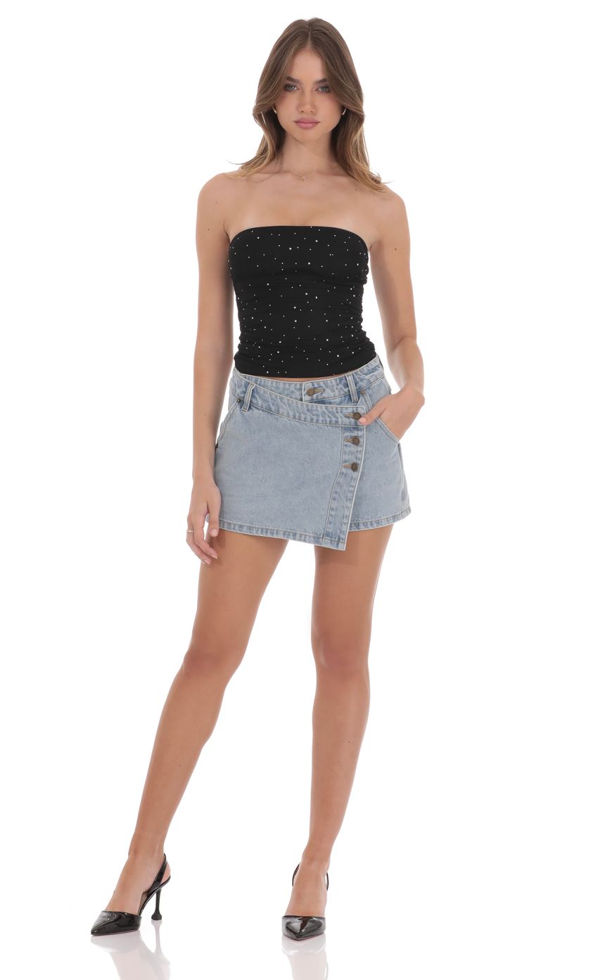 Picture Overlap Button Denim Skirt in Light Blue. Source: https://media-img.lucyinthesky.com/data/product-media/850xAUTO/b5e4444f-37d1-4bbe-88e5-2fbcd8aef4c0.jpg