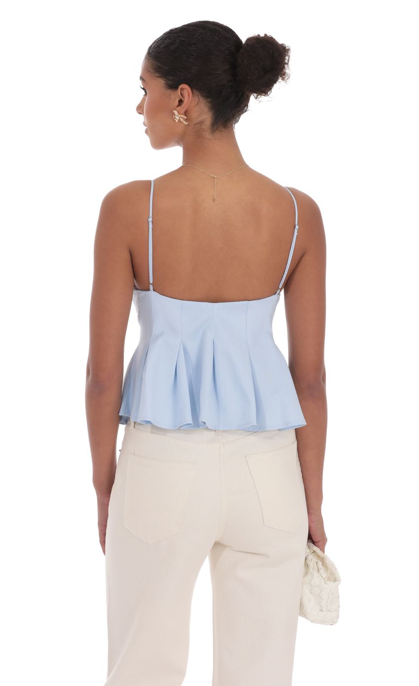 Picture Pinstripe Pleated Flare Top in Sky Blue. Source: https://media-img.lucyinthesky.com/data/product-media/850xAUTO/b9065bdc-41a2-40f9-9c62-663ed0ef92d8.jpg