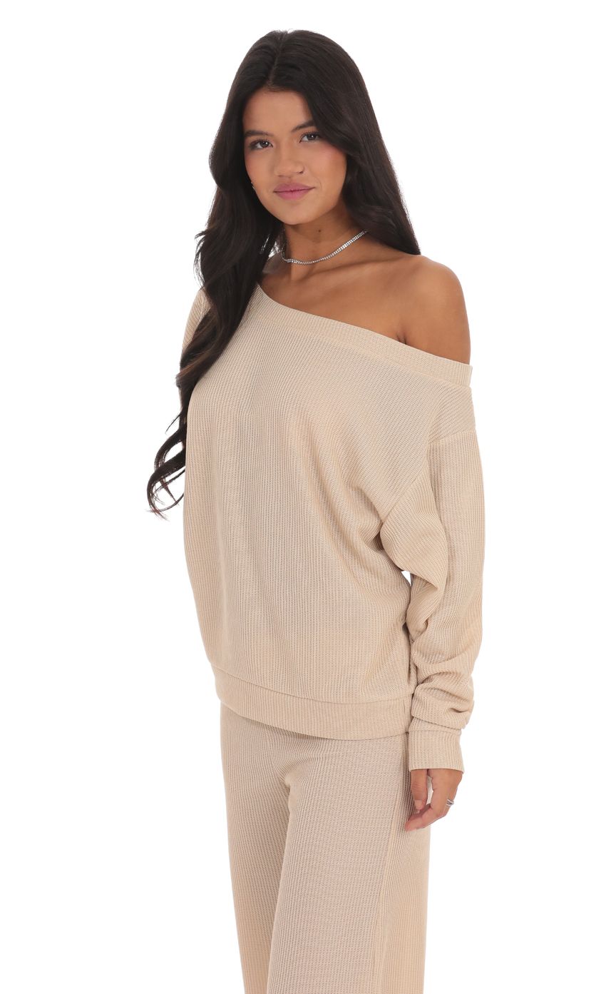 Picture Off Shoulder Knit Oversized Jumper in Beige. Source: https://media-img.lucyinthesky.com/data/product-media/850xAUTO/ba461731-658f-4b00-90bb-4287ac92e1a6.jpg