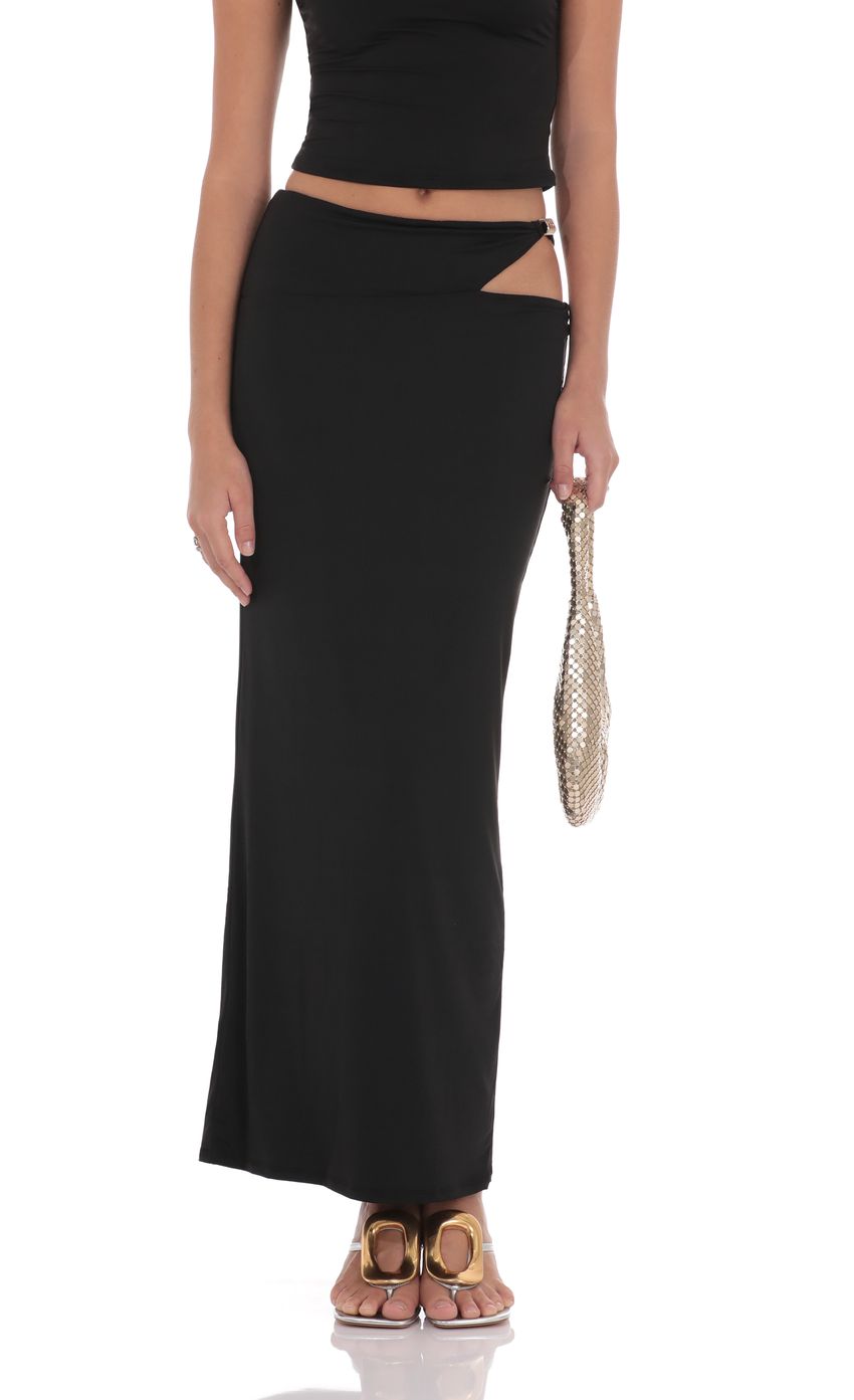 Picture Cutout Embellished Maxi Skirt in Black. Source: https://media-img.lucyinthesky.com/data/product-media/850xAUTO/bc5657cc-423f-450a-b64a-15035bc3d907.jpg