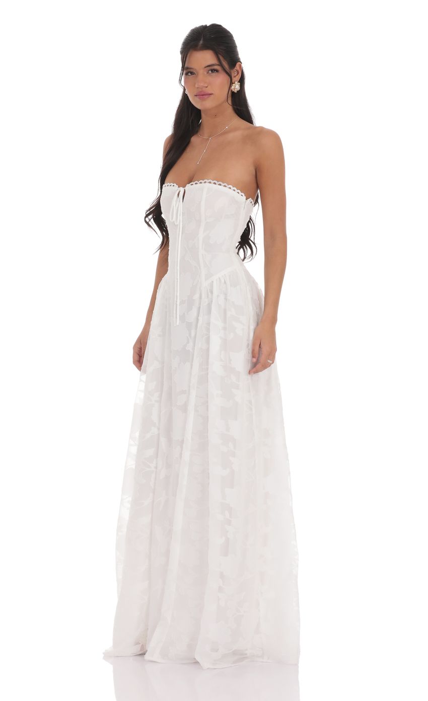 Picture Floral Lace-Up Maxi Dress in White. Source: https://media-img.lucyinthesky.com/data/product-media/850xAUTO/bfbb3994-6df4-45ff-aa96-0de855e2c16c.jpg