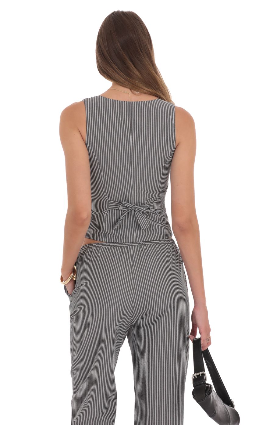 Picture Pinstripe Buttoned Vest in Grey. Source: https://media-img.lucyinthesky.com/data/product-media/850xAUTO/d1588059-9f84-4e16-8acc-1ad986559cc1.jpg