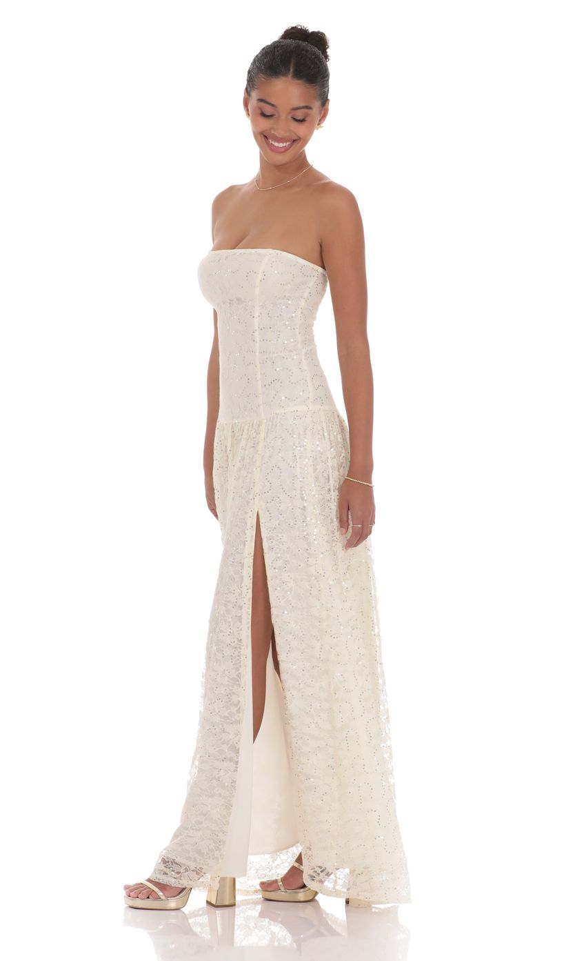 Picture Lace Sequin Drop Waist Maxi Dress in Cream. Source: https://media-img.lucyinthesky.com/data/product-media/850xAUTO/d29372a8-571c-4eff-a591-0cf0dc39e0fb.jpg