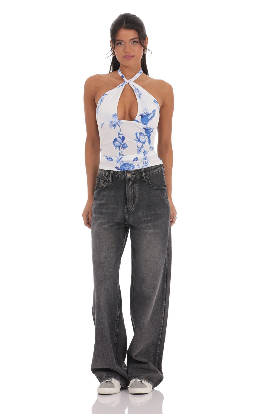 Picture Floral Cross Neck Halter Top in White. Source: https://media-img.lucyinthesky.com/data/product-media/850xAUTO/dba7314e-4c6a-49db-865a-c69f8a67123e.jpg