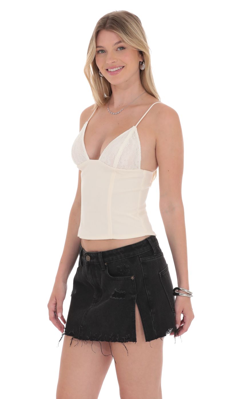 Picture Low Rise Distressed Denim Skirt in Black. Source: https://media-img.lucyinthesky.com/data/product-media/850xAUTO/dbaf008c-ba87-4280-a847-2c4436f4fa21.jpg