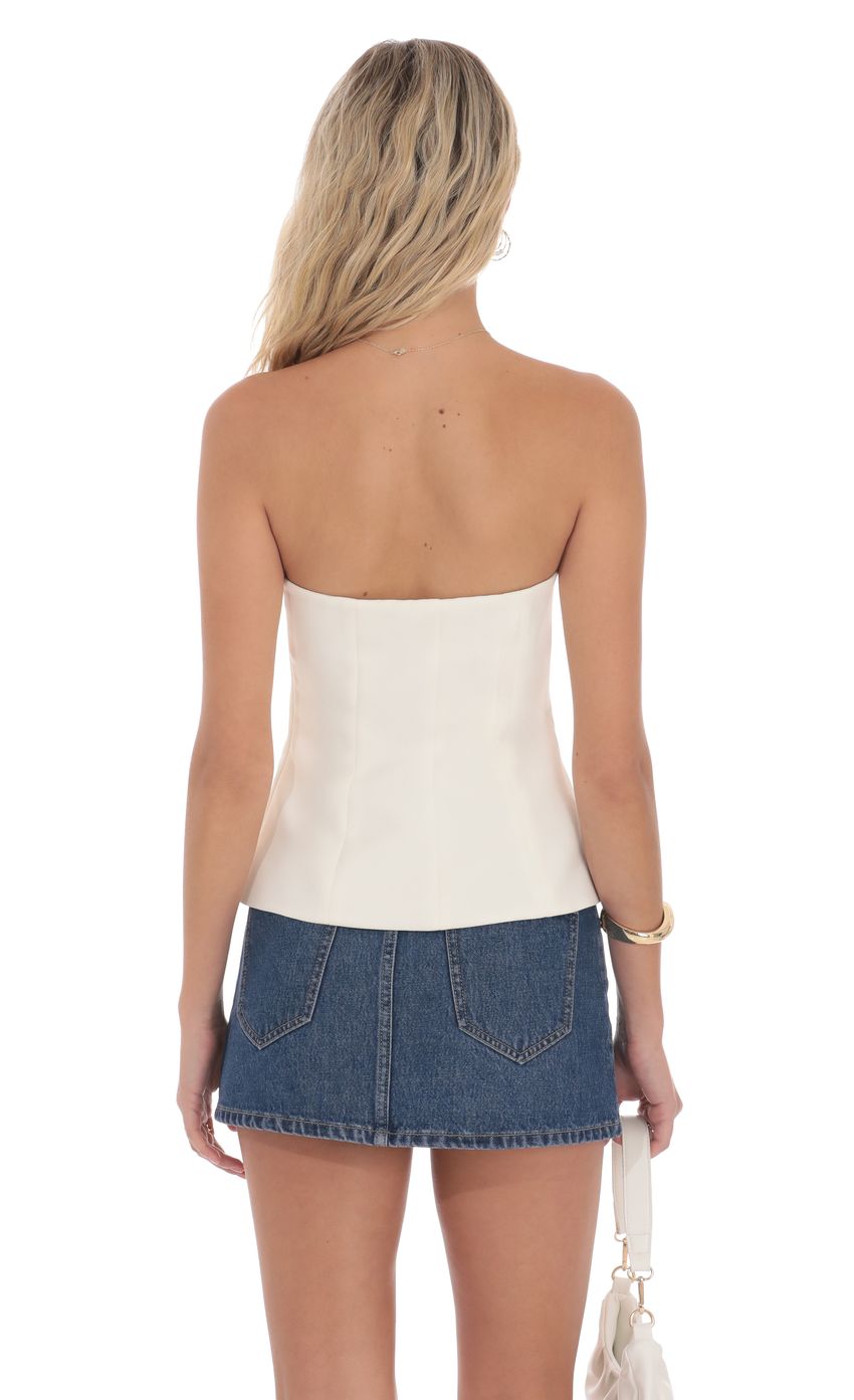 Picture Strapless Tailored Vest in Ivory. Source: https://media-img.lucyinthesky.com/data/product-media/850xAUTO/df1aa401-95f8-4cf5-805f-20dffe066065.jpg