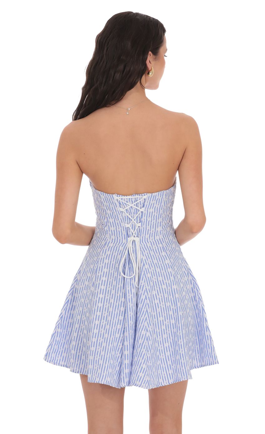 Picture Striped Floral Strapless Dress in Blue and White. Source: https://media-img.lucyinthesky.com/data/product-media/850xAUTO/dfa4e09a-8dce-4907-a64c-926782313aa9.jpg