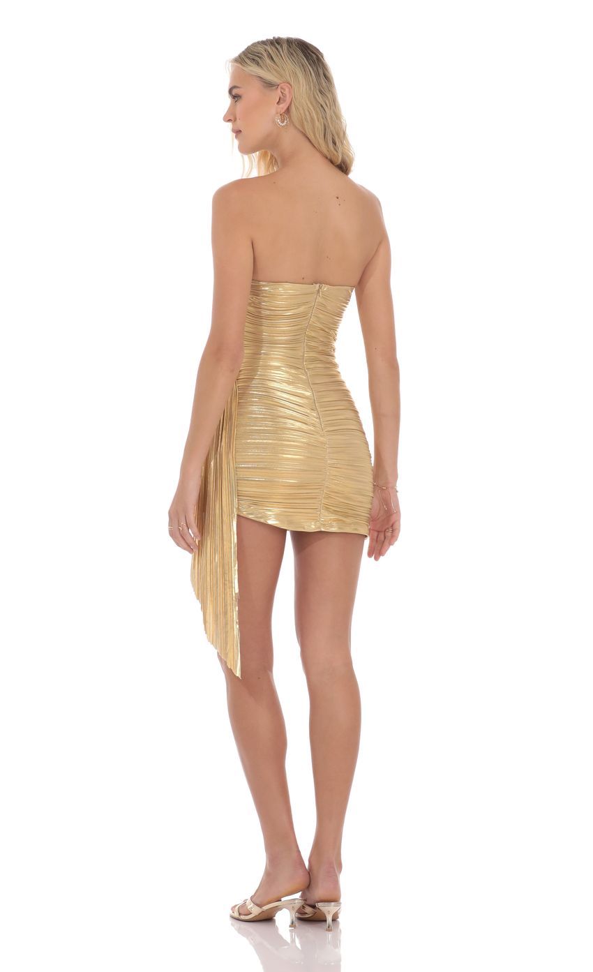 Picture Metallic Corset Tassel Dress in Gold. Source: https://media-img.lucyinthesky.com/data/product-media/850xAUTO/e1f851fc-a442-4710-8ac6-4bc4dc0a8601.jpg