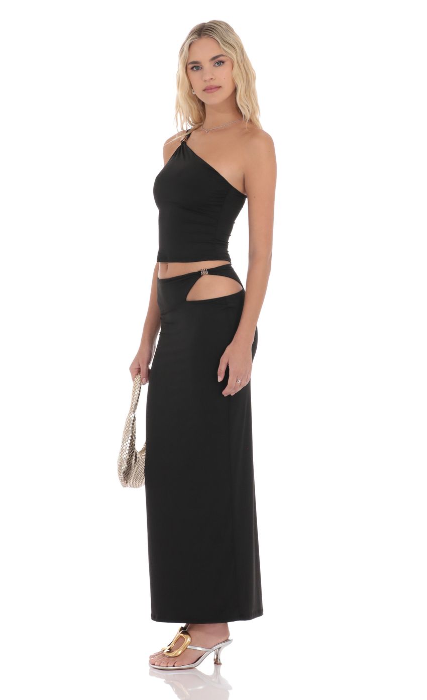 Picture Cutout Embellished Maxi Skirt in Black. Source: https://media-img.lucyinthesky.com/data/product-media/850xAUTO/e5e64fa8-222a-4906-87ae-8c3d85365d03.jpg