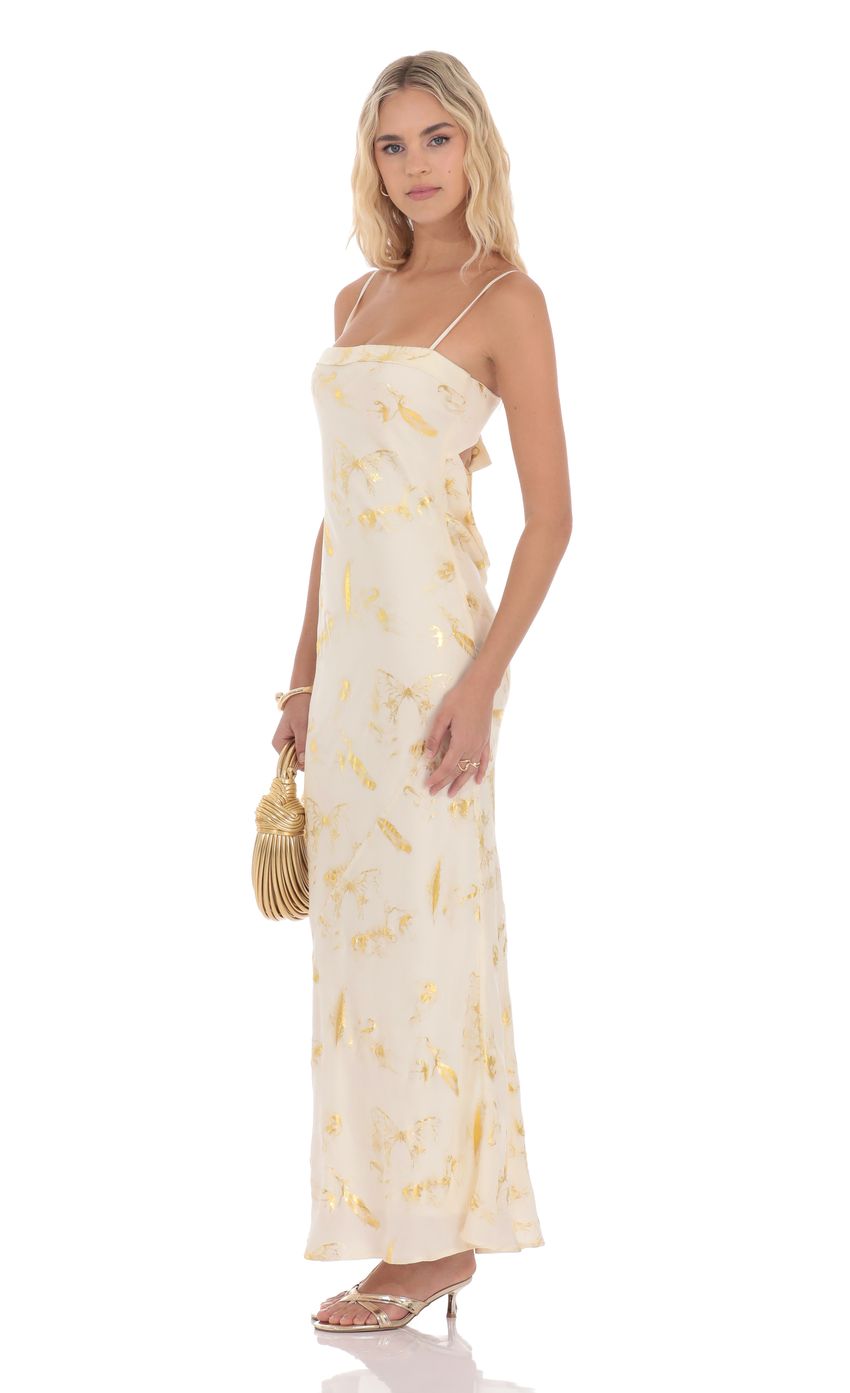 Picture Butterfly Foiled Open Back Maxi Dress in Cream. Source: https://media-img.lucyinthesky.com/data/product-media/850xAUTO/e74236b5-58ab-4f76-8d5e-cb53825b0fc4.jpg