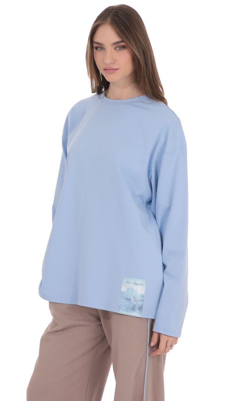 Product image for Lucy Graphic Crewneck Shirt in Light Blue