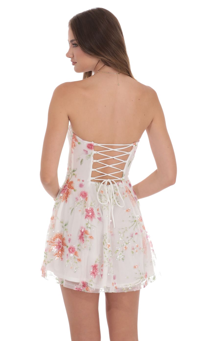 Picture Sequin Floral Strapless Dress in White. Source: https://media-img.lucyinthesky.com/data/product-media/850xAUTO/ee426a31-8c74-441e-949a-2e29f6268b7d.jpg