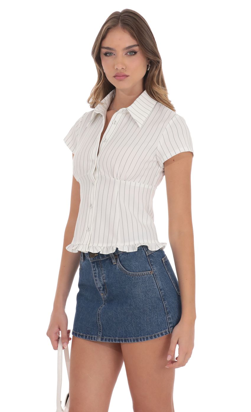 Picture Button-Up Ruffle Top in White Stripes. Source: https://media-img.lucyinthesky.com/data/product-media/850xAUTO/efcdf72c-4e38-4daf-b997-006bb802ffa1.jpg