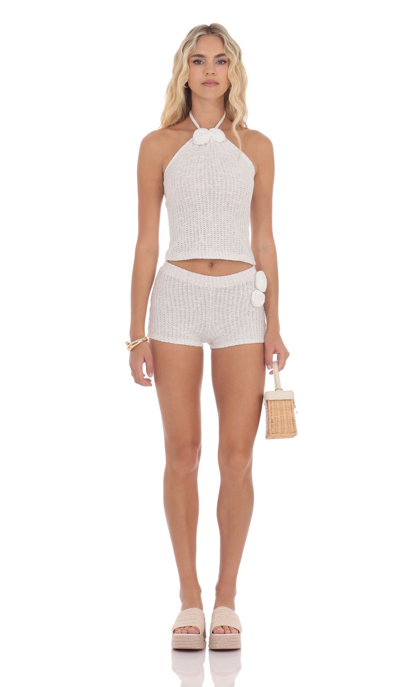 Picture Crochet Rosette Halter Top in White. Source: https://media-img.lucyinthesky.com/data/product-media/850xAUTO/f3add6ec-ee55-46e2-a3c0-a8989c295f55.jpg
