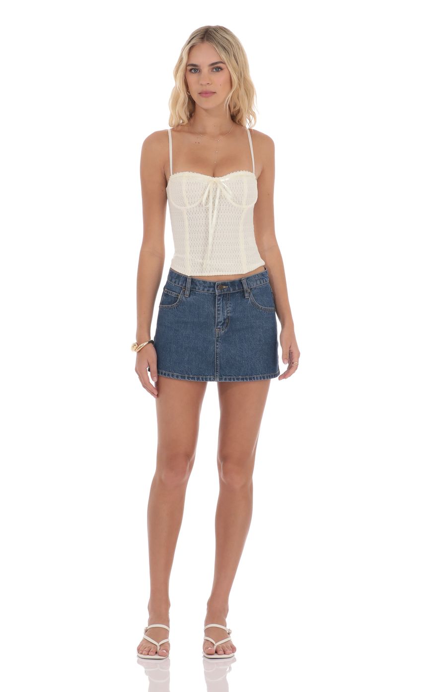Picture Low Rise Denim Mini Skirt in Blue. Source: https://media-img.lucyinthesky.com/data/product-media/850xAUTO/f56859d5-c8e2-4cea-89e5-bb6200edc47f.jpg