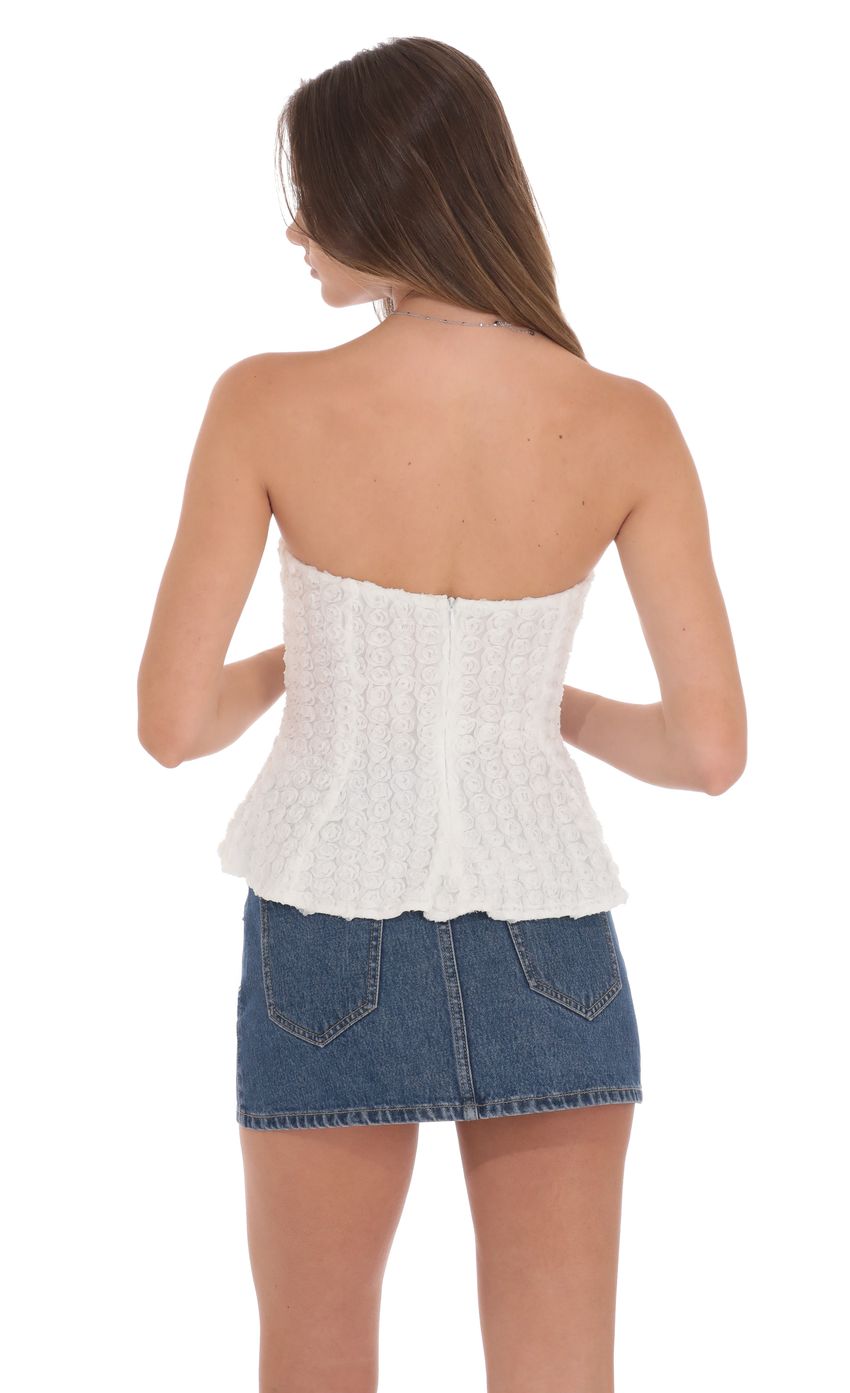 Picture Floral Strapless Peplum Top in White. Source: https://media-img.lucyinthesky.com/data/product-media/850xAUTO/f5af0327-4bfb-4264-b16c-52696268194a.jpg